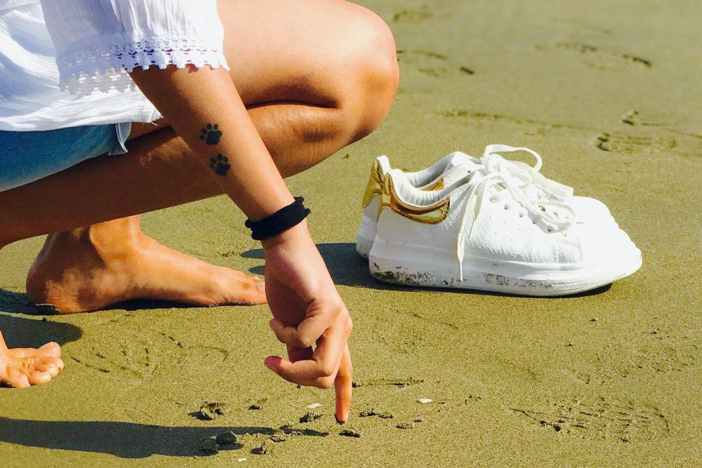 barefoot woman on beach
