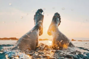 feet of person swimming